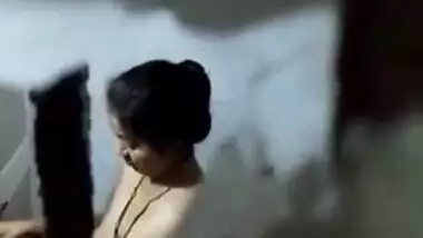 There is a hole in the bathroom and perv films the naked Indian
