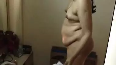 Paunchy Desi woman with small tits shows her body in the porn video